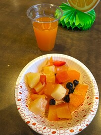 Sliced fruit and peach cocktail juice