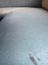 Booth seats were filthy and covered in food crumbs.