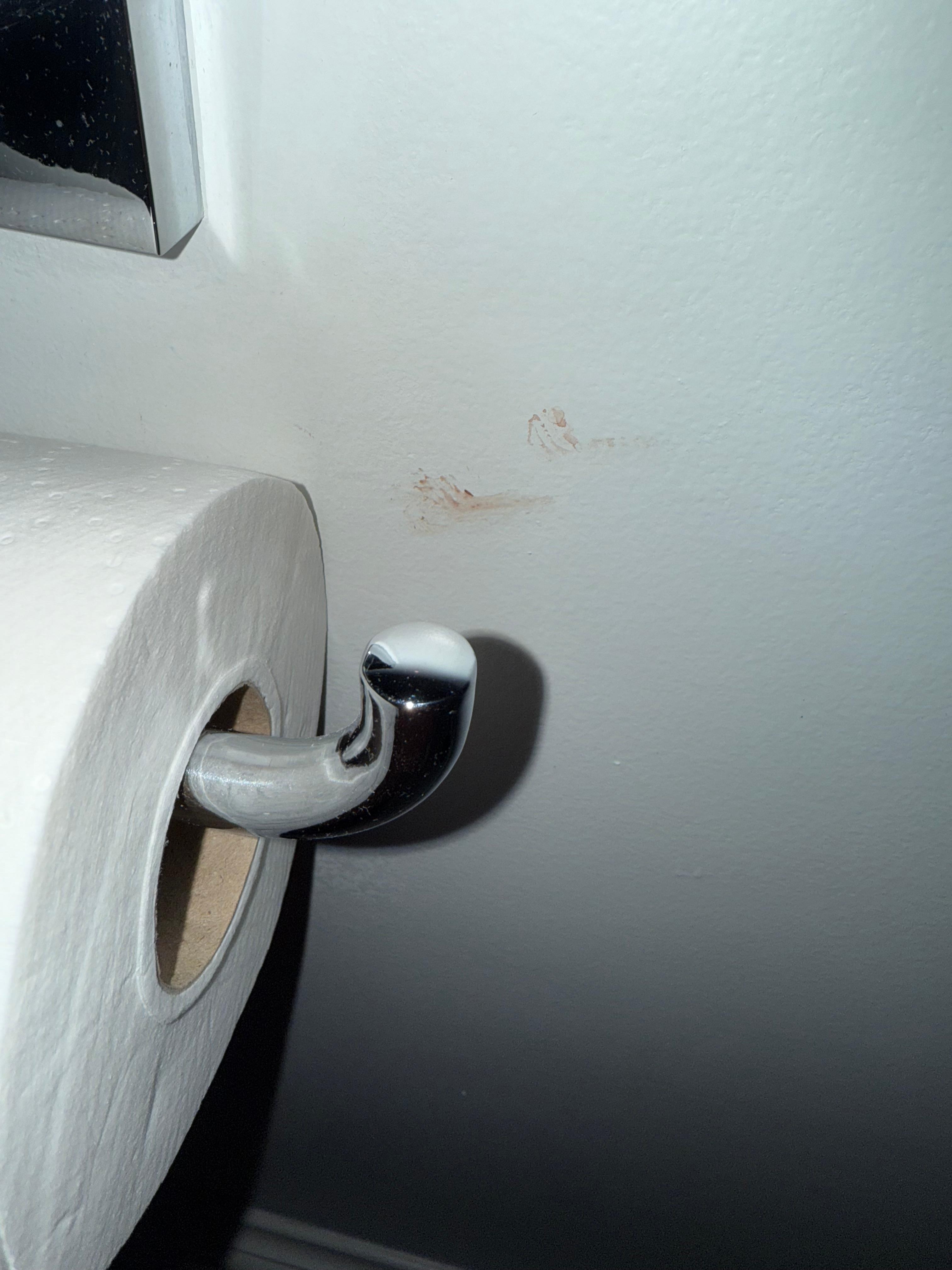 What appears to be blood on the wall in the upstairs bathroom. 