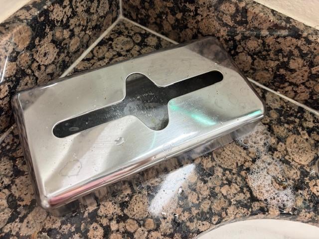 Permanent tissue box screwed to the vanity prevented us from clearing the vanity top to put our own belongings on there & spread our things out comfortably. 