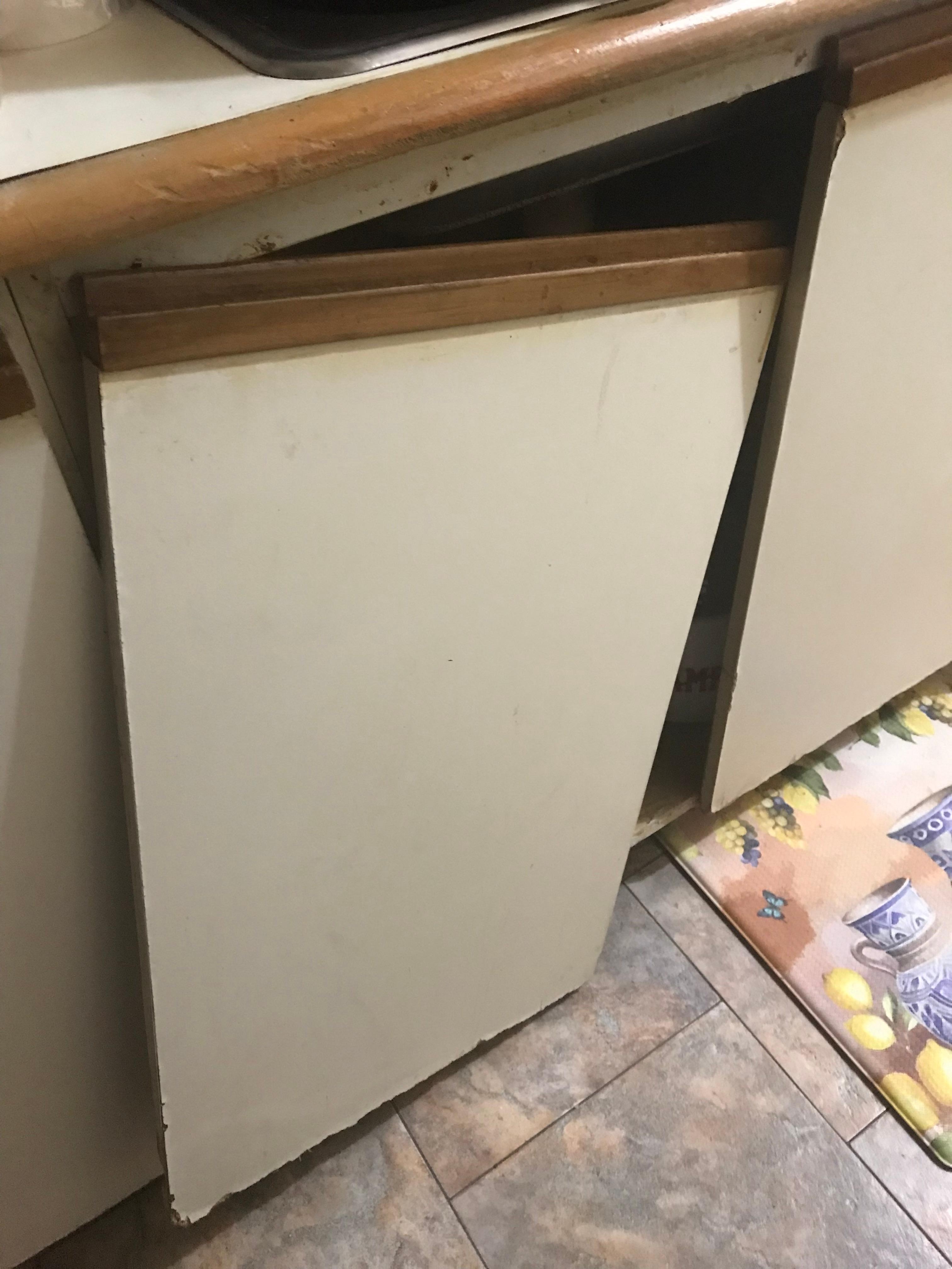 kitchen sink cabinet door falls off when open