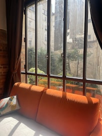 Comfy couch with beautiful courtyard view