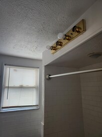 No lighting in the bathroom (DARK SHOWERS). Notified owner twice, said he was sending someone out