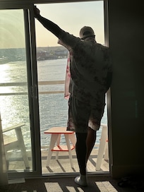 The view inside the room while hubby looks out over the bay from the 7th floor balcony