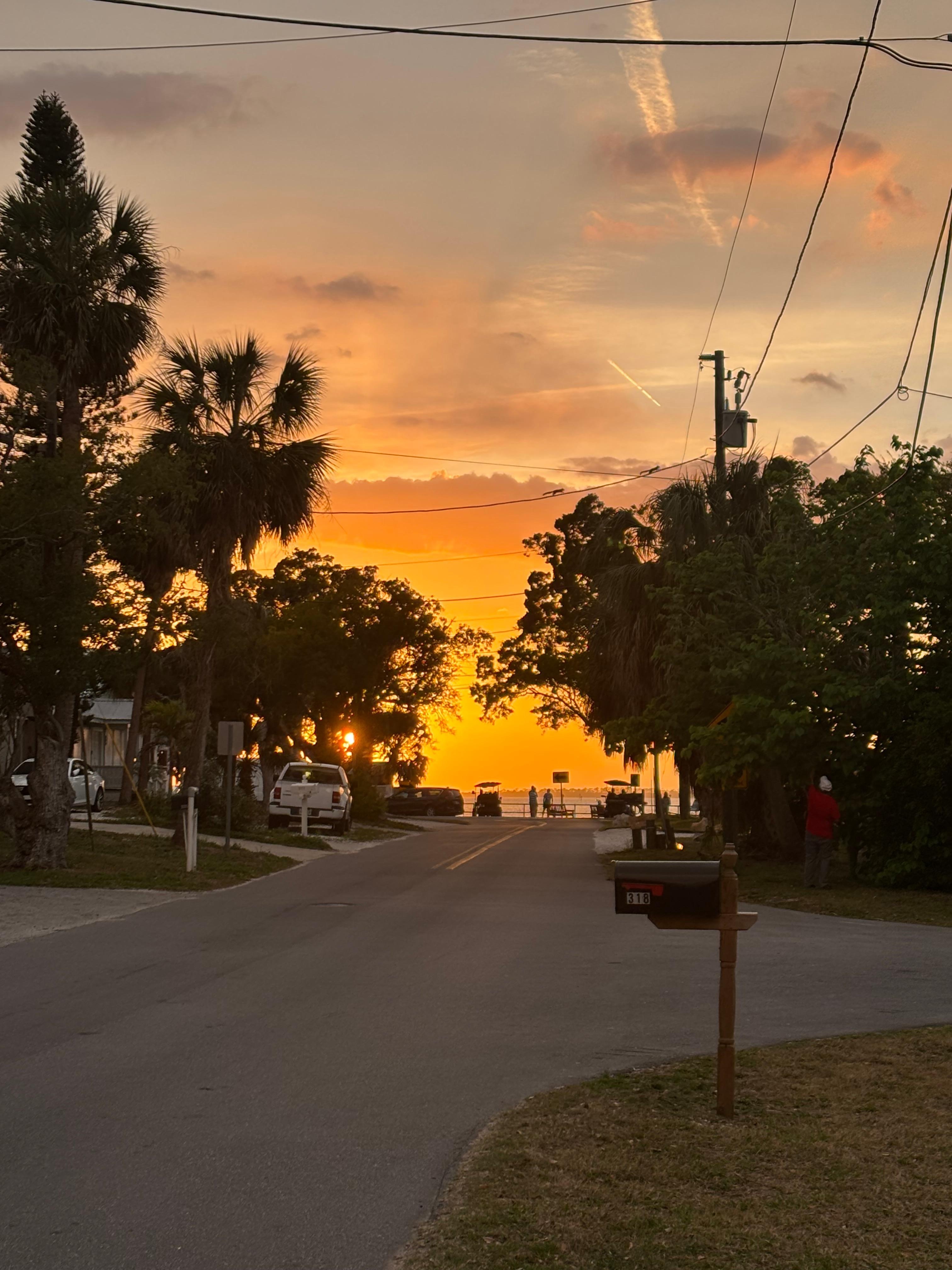 Sunset from the road in front of the home.   The water is only 3 houses away.