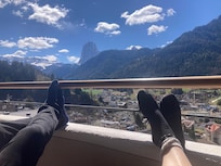 Relaxing on the balcony after the walk up from town. Cheers