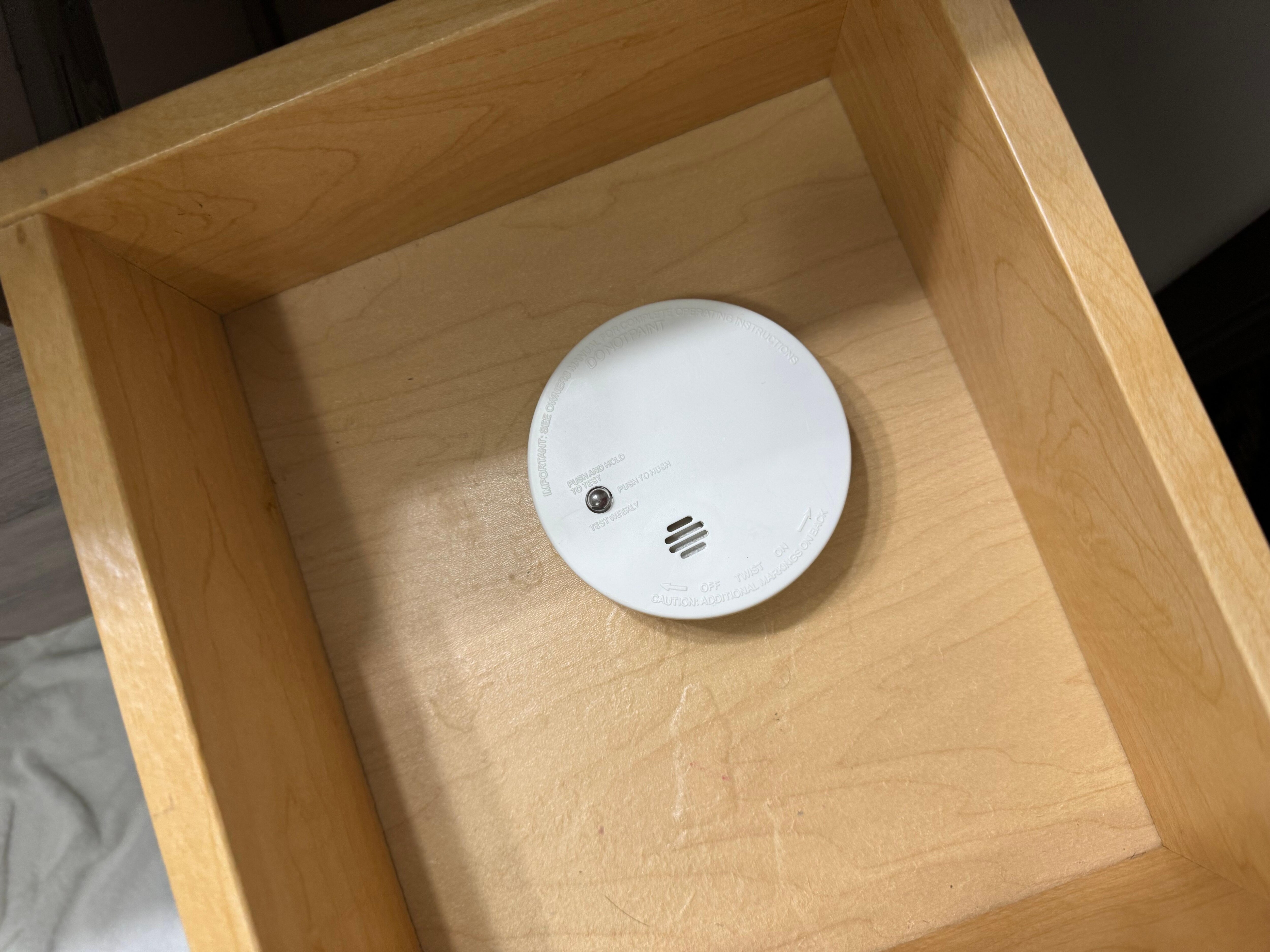 Smoke detector in bathroom small drawer.