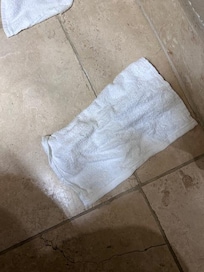 Dirty washcloth in curtain