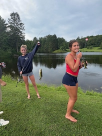 Big sisters fishing while the boys played baseball.