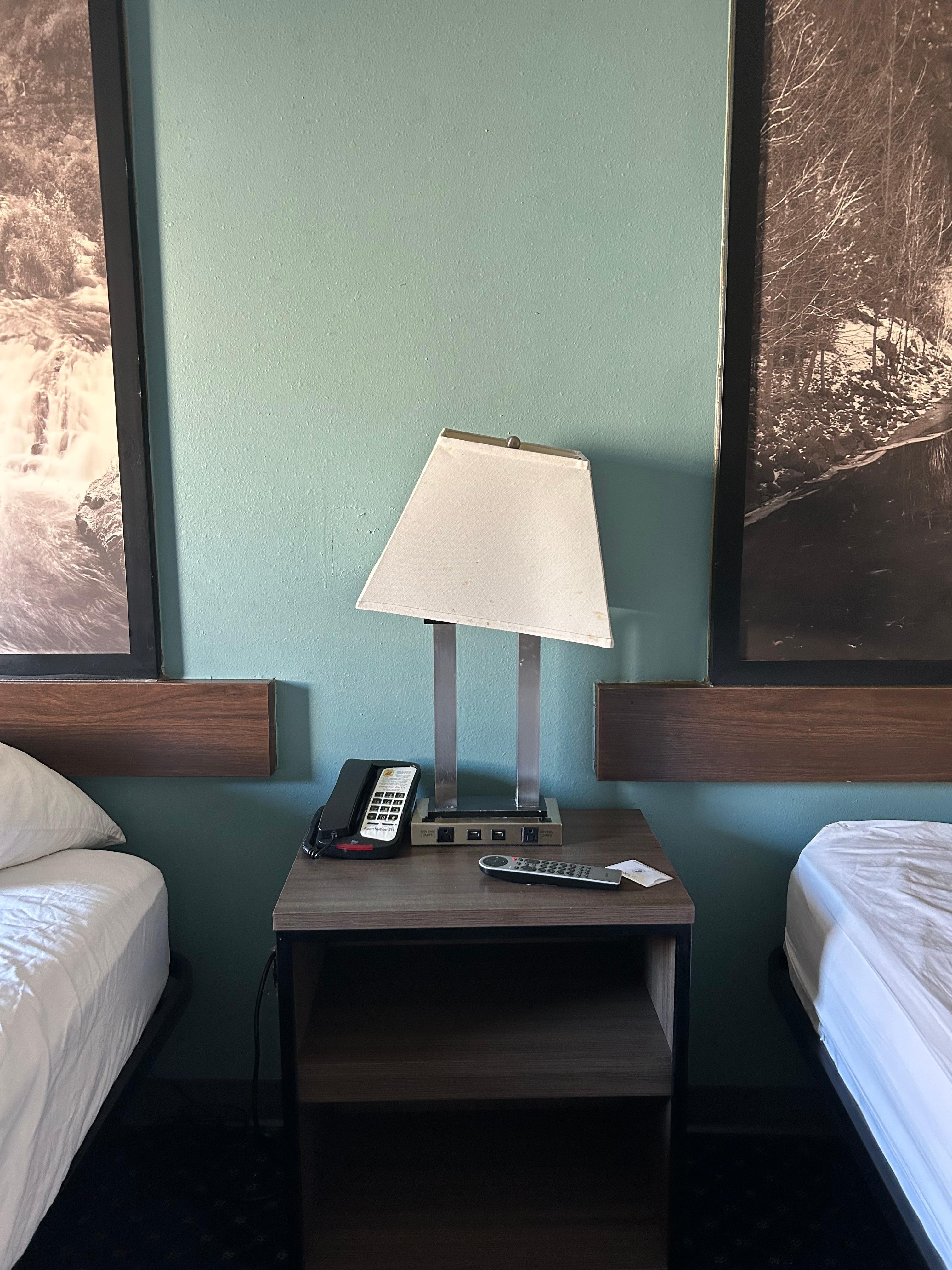 Crooked/Broken Dirty Lamp Shade. Only 1 bulb worked, the outlets on it also did not work.