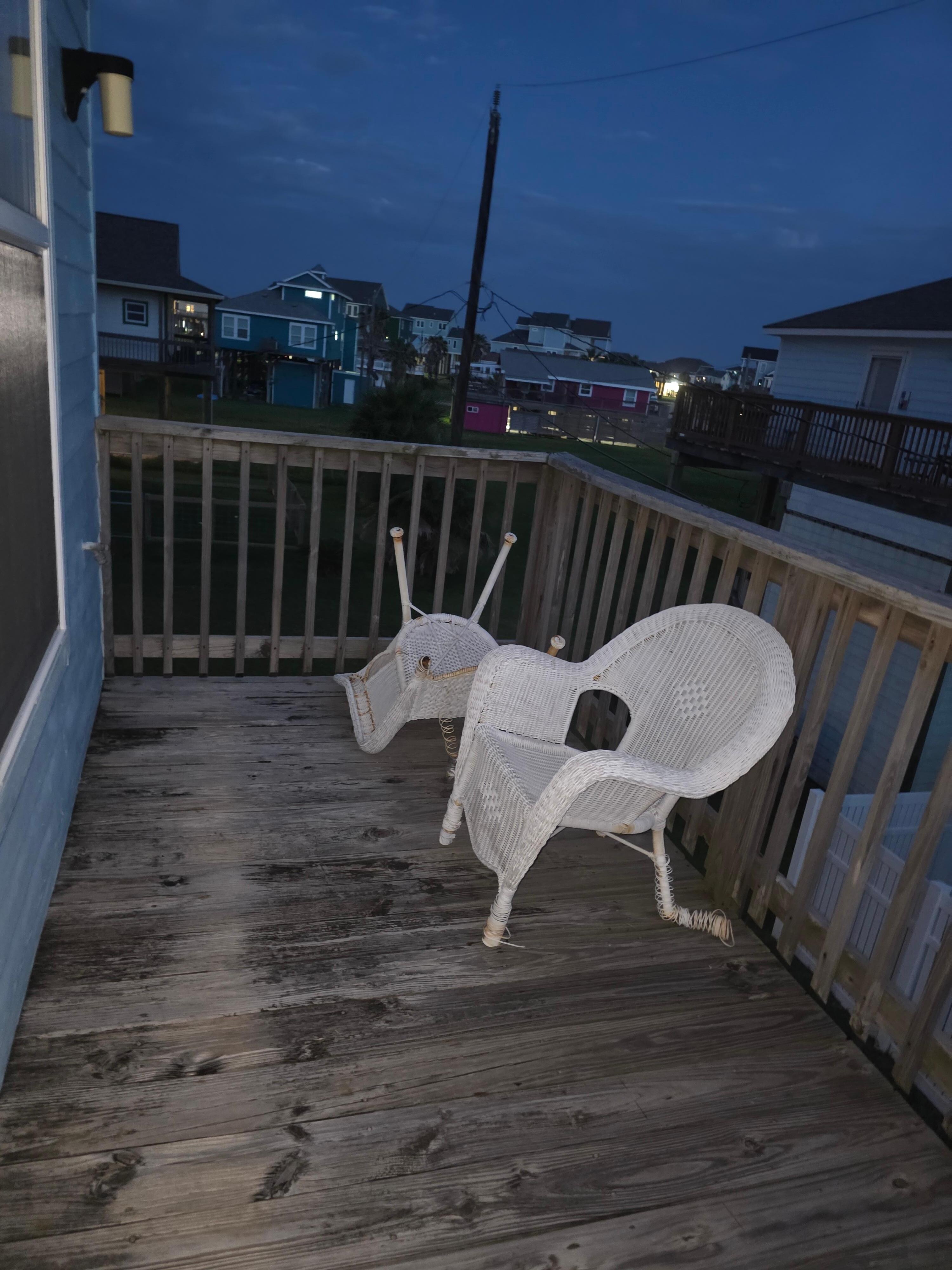 Outside the master bedroom, broken furniture. 