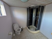 This shower connected to the recreation room does not have a mount for the shower head.