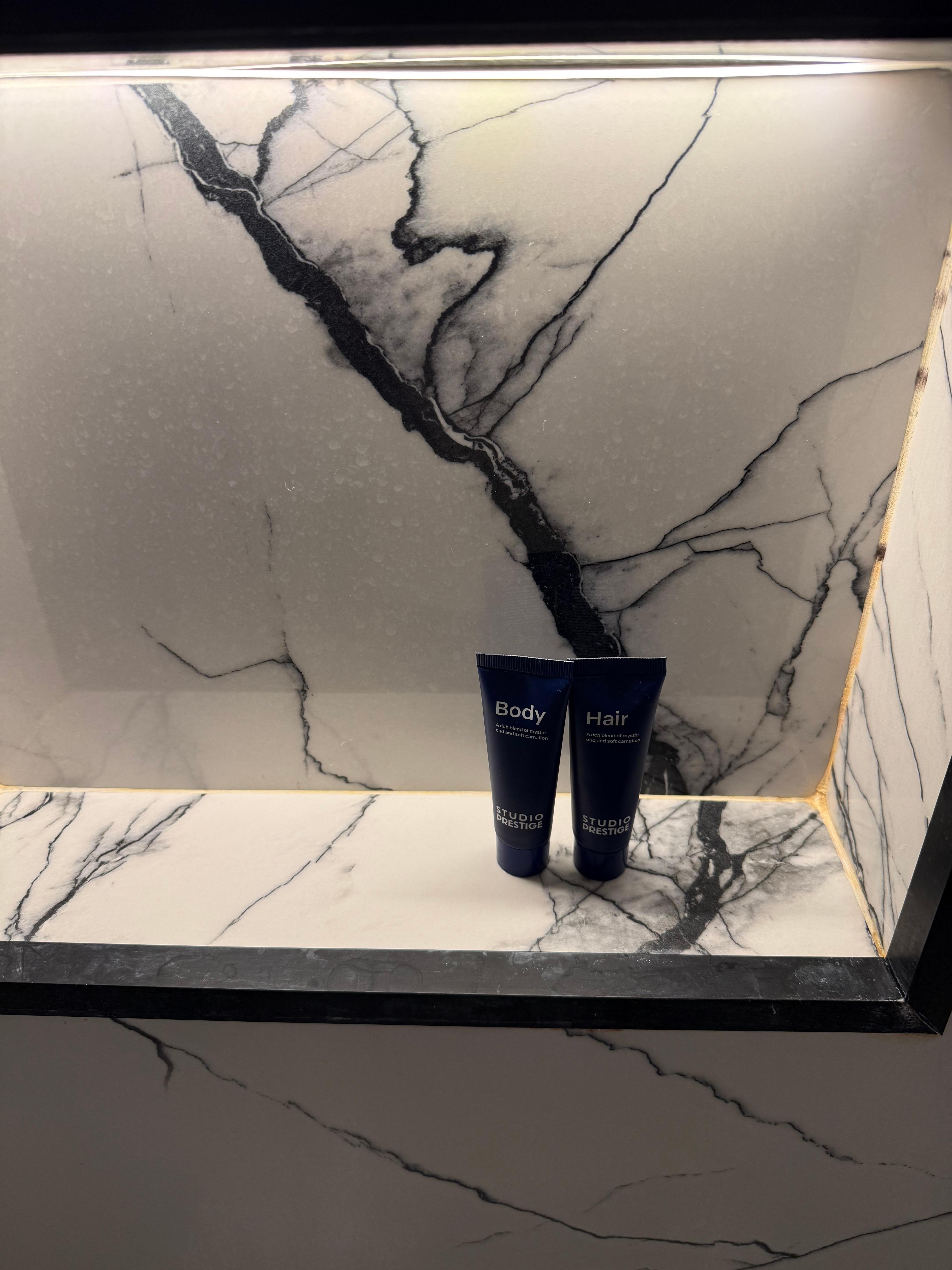 Small travel sized body wash and shampoo for a 7-night stay