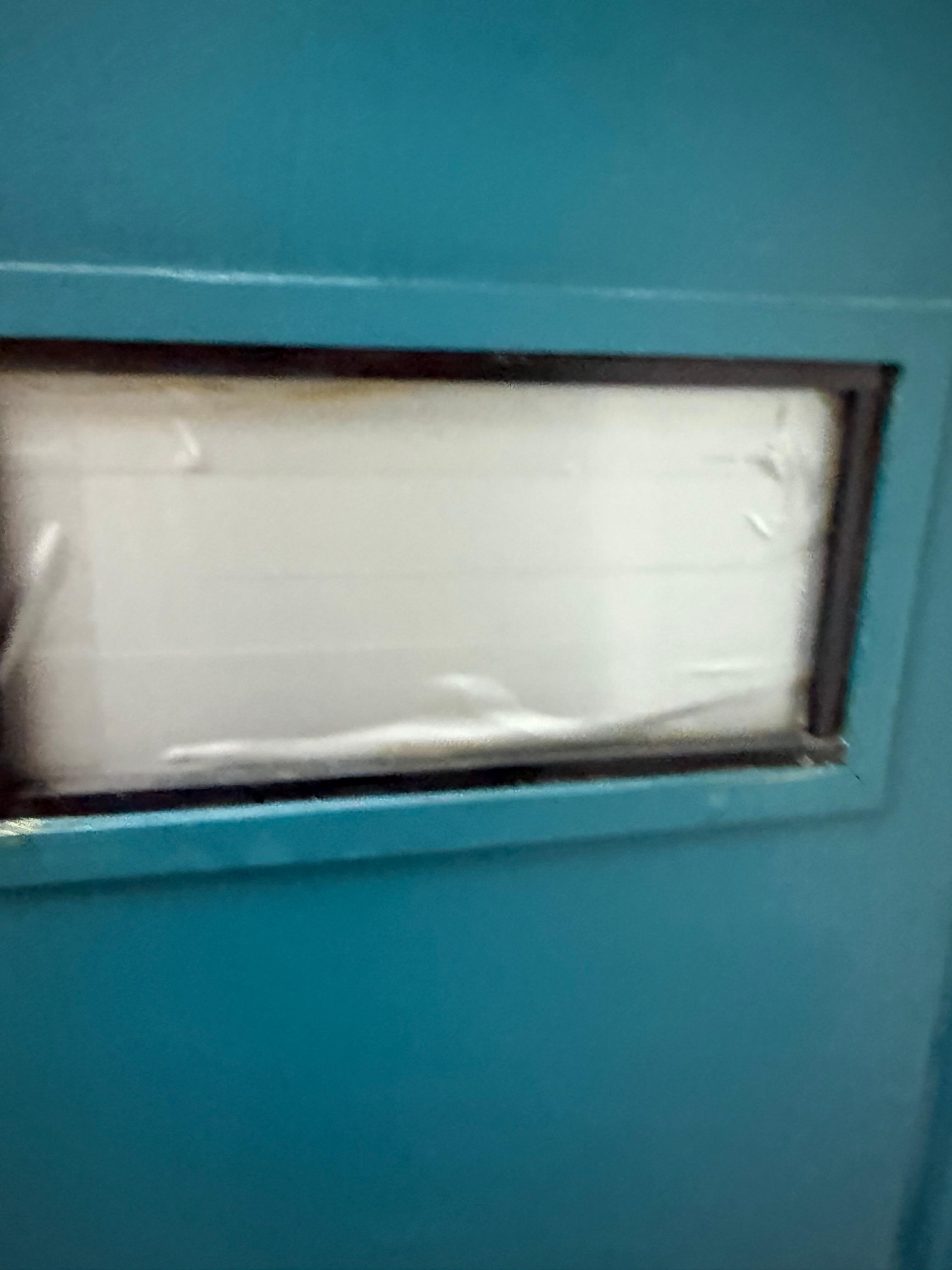 Duct tape covering the window to the main door. 