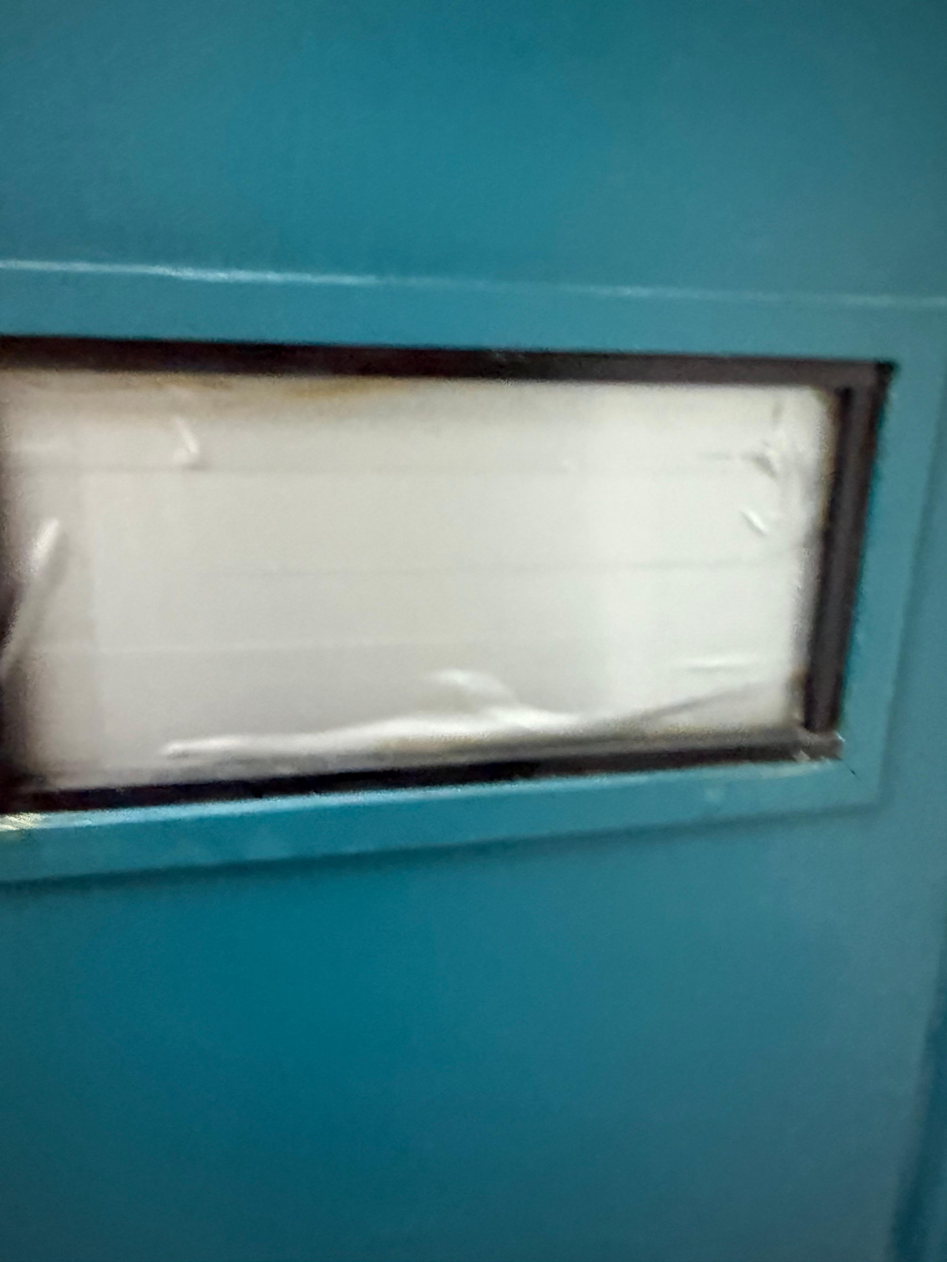 Duct tape covering the window to the main door.