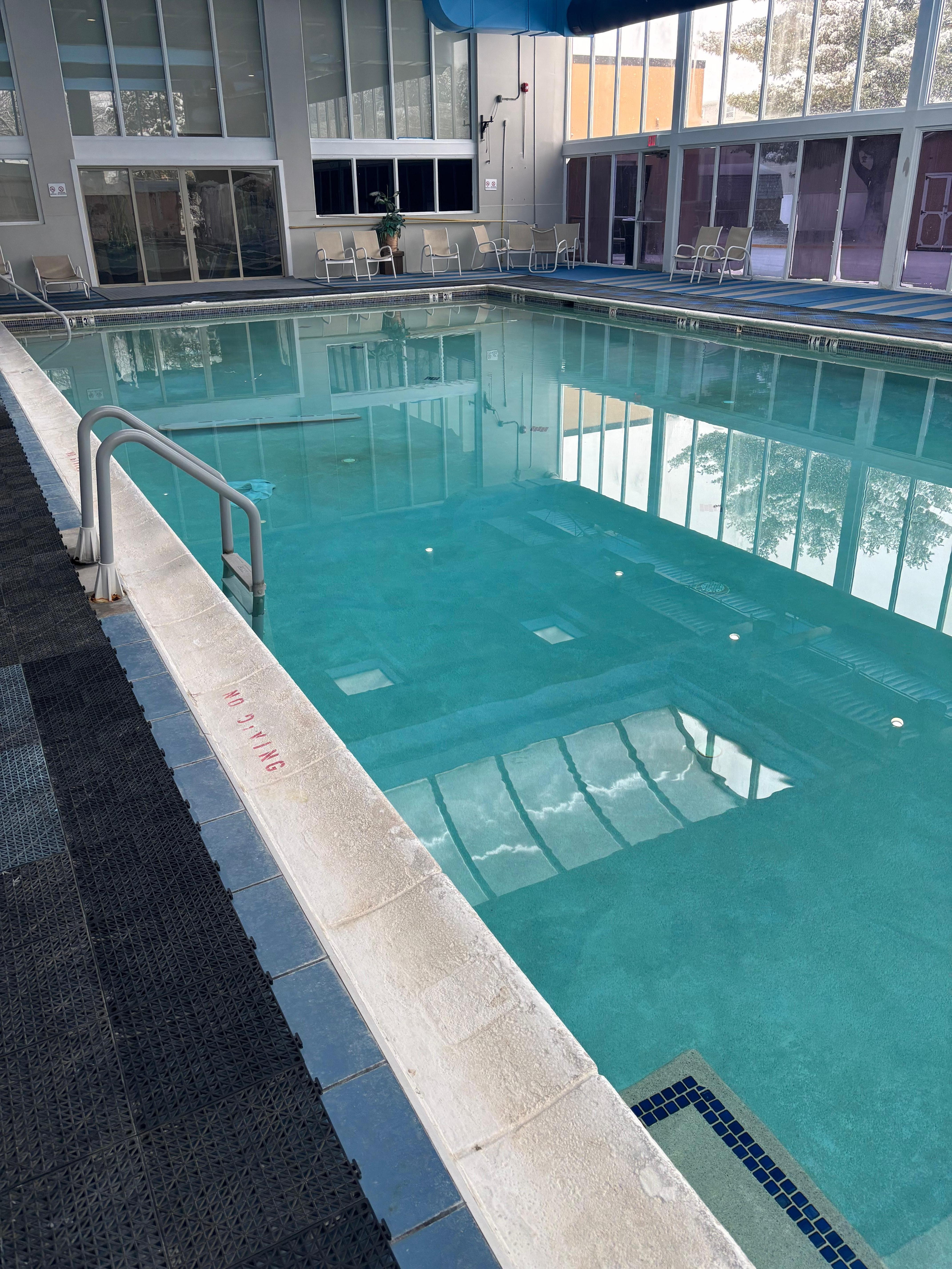Mildew pool very bad stench no chlorine in sight hairs floating everywhere towel sitting at bottom of pool for who knows how long went as soon as it opened so was not cleaned the prior night. Old rusty diving board sunken at the bottom. I ran home.