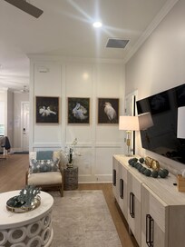 The living room looking towards the entrance and the kitchen