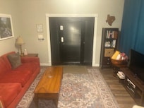 Den area with TV, wooden building blocks, kids books, board games, …