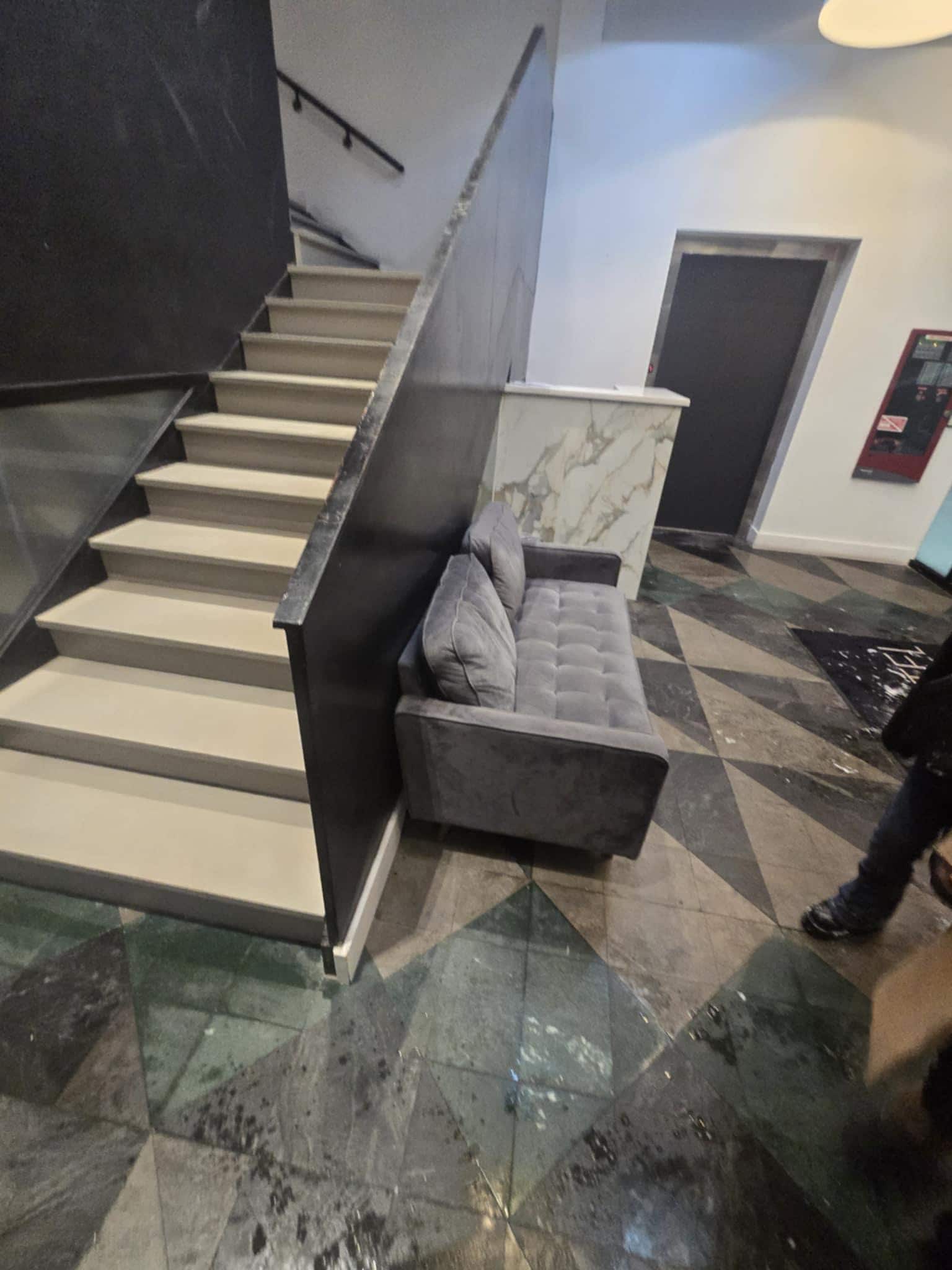 What appears to have a desk for someone to direct no one ever there sloppy floors also filthy 