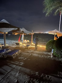 Romantic dinner on the beach.