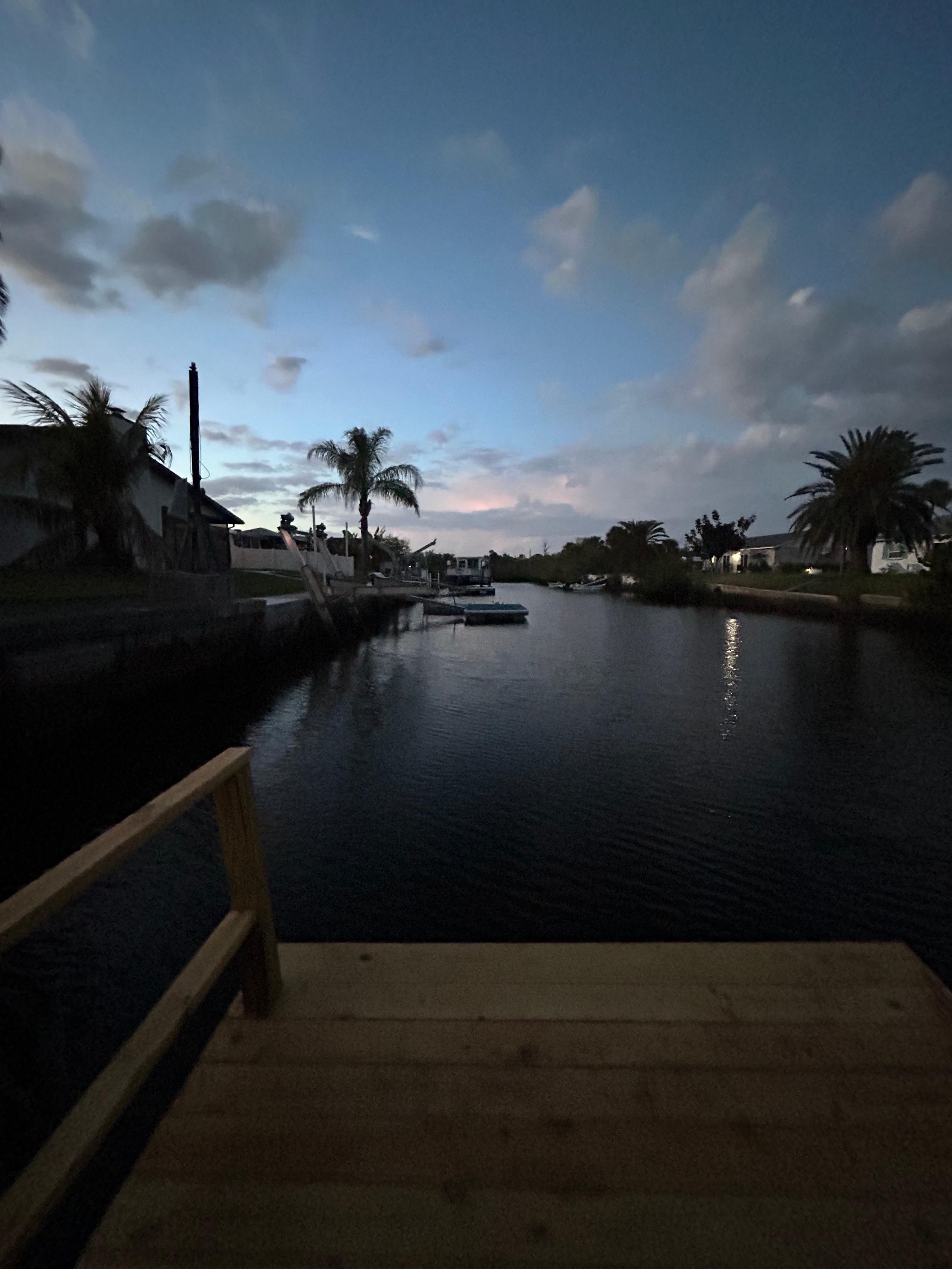Looking down the canal from the dock at evening time.