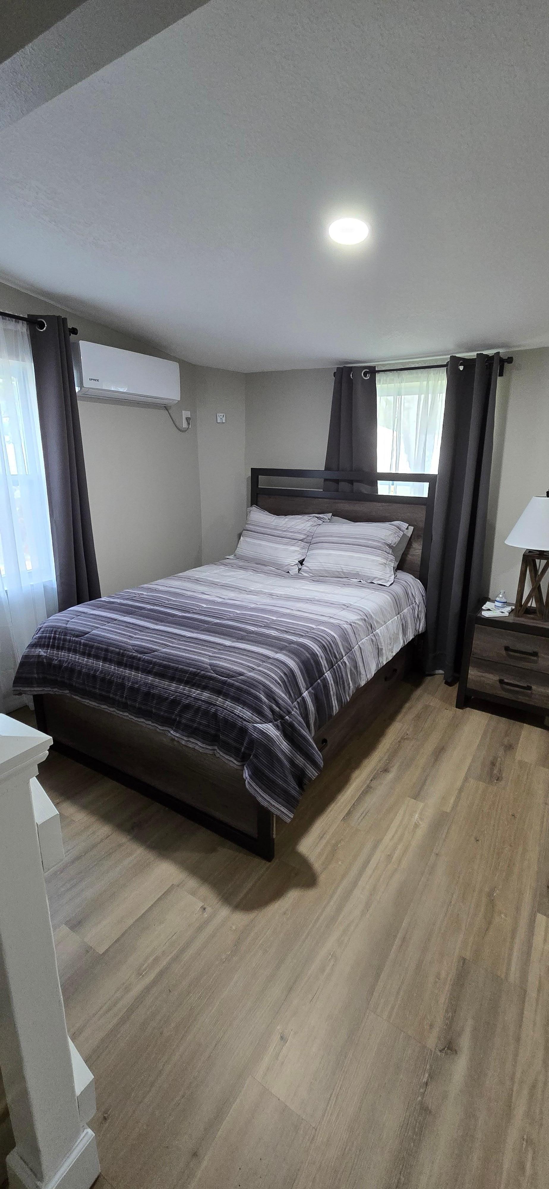 Back bedroom is very spacious, there are a couple of steps to get to it. But very good, sturdy railings. It also has it's own temperature control.