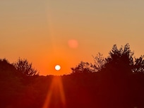 Beautiful sunset outside the front door of house
