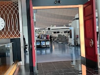 Entrance to hotel is next to Departures aisle O