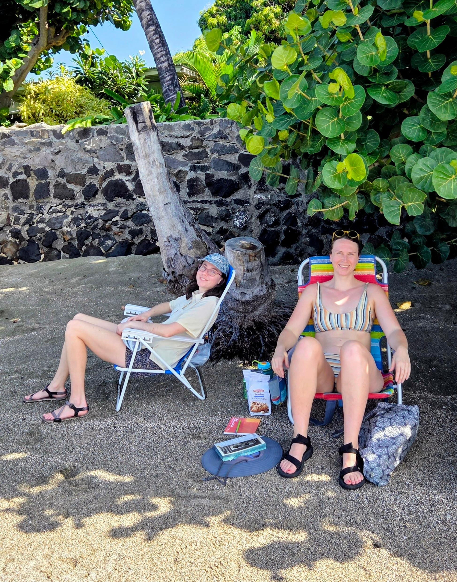 Shady beach with lava tide pools across the street