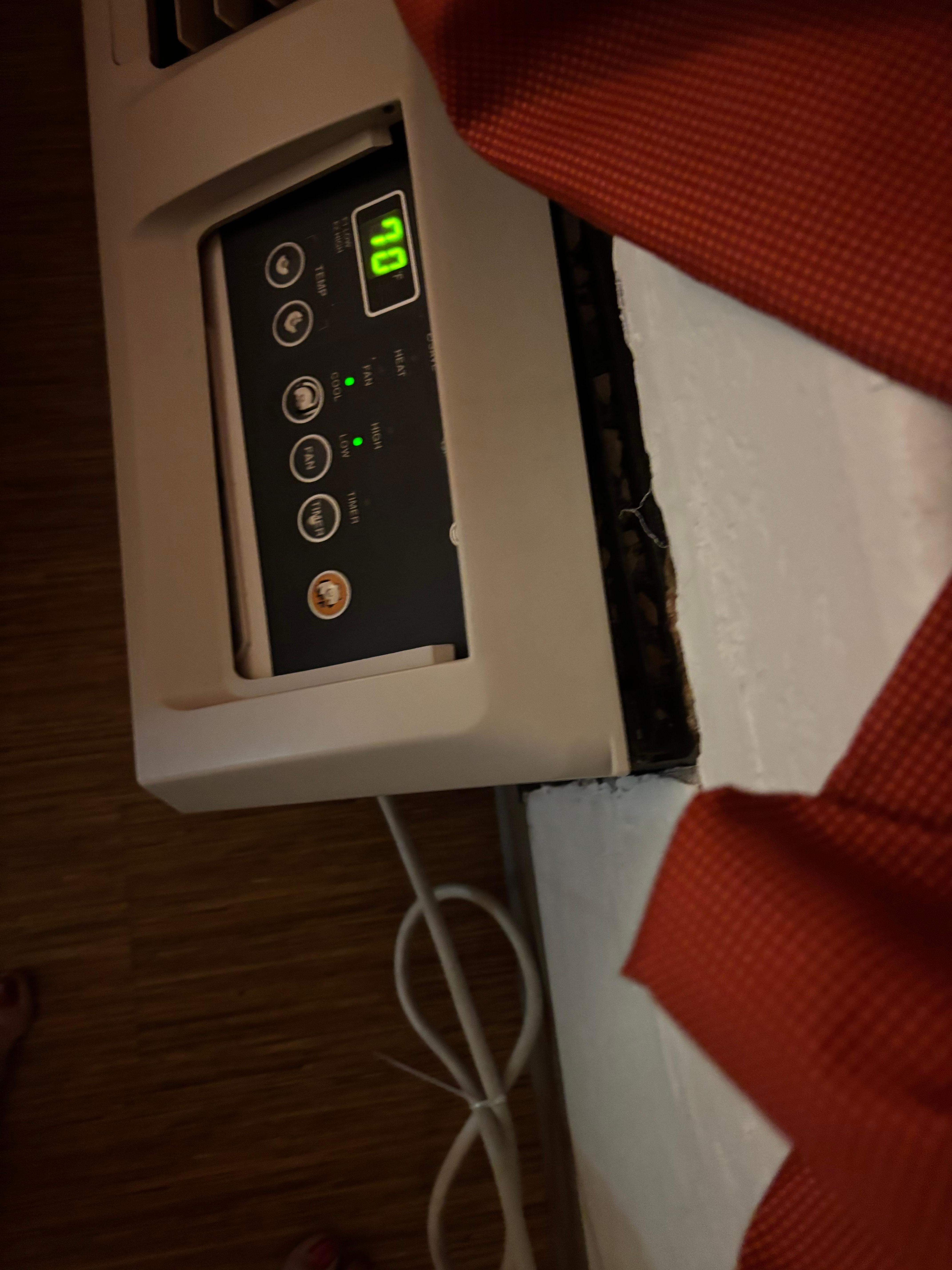 Air conditioner pulled off wall and very noisy