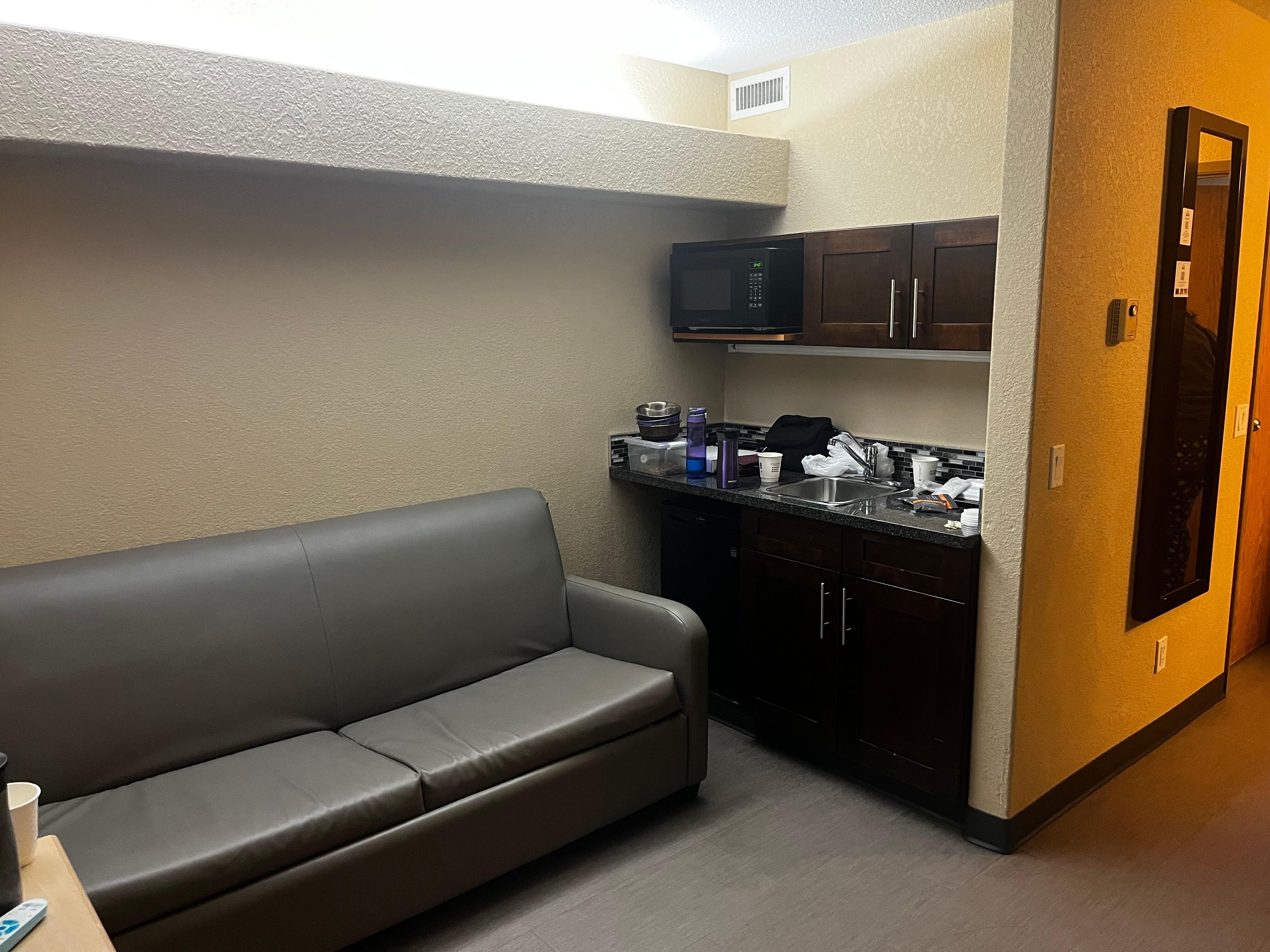 Tv was on the left on the wall, couch and kitchen area. 