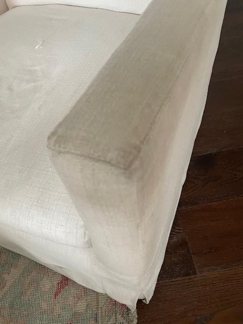 The arm of one of the living room chairs.