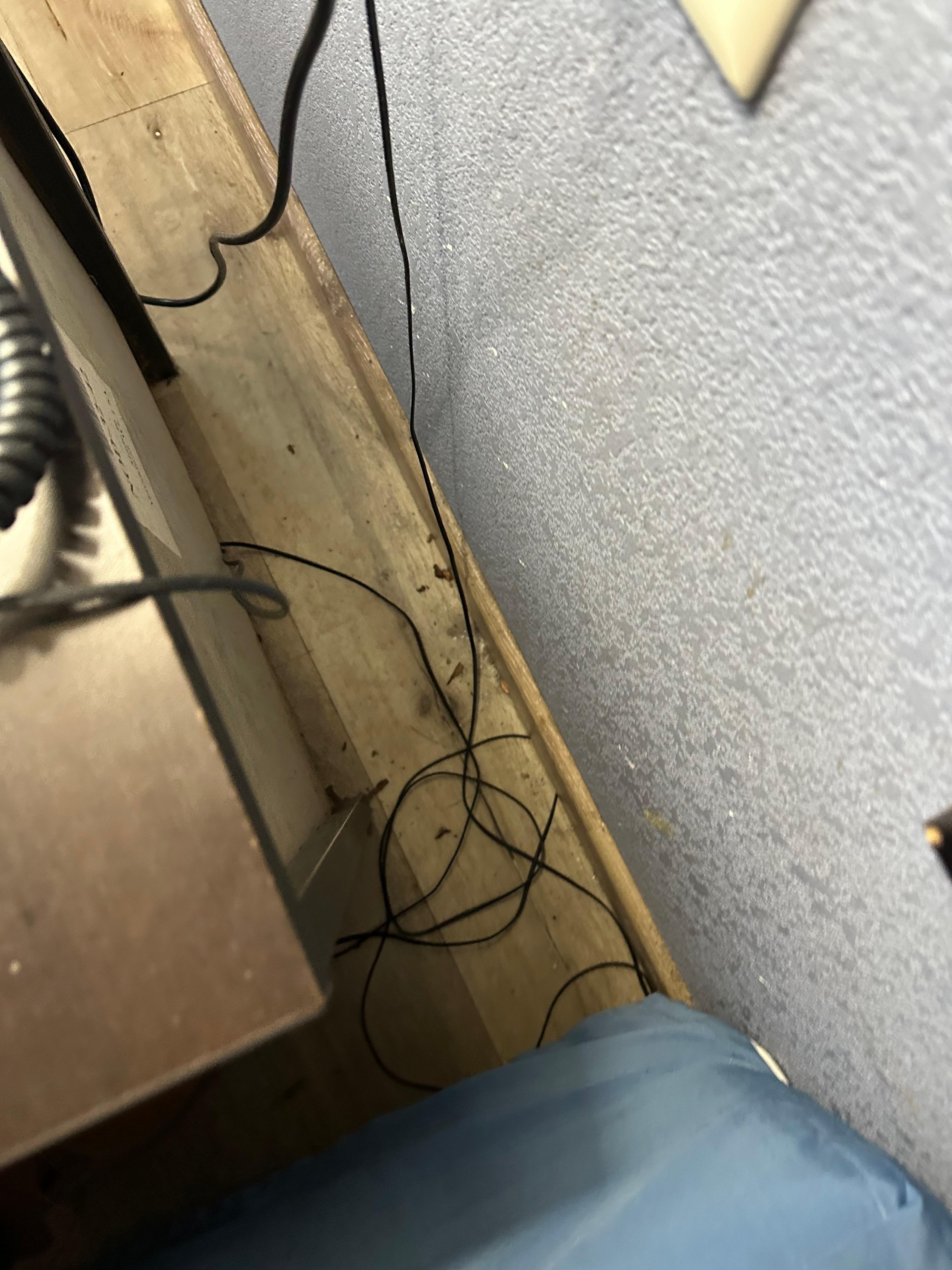 Behind the nightstand 