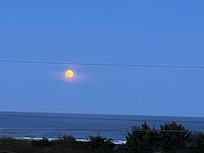 Moonset and a full double rainbow in full display