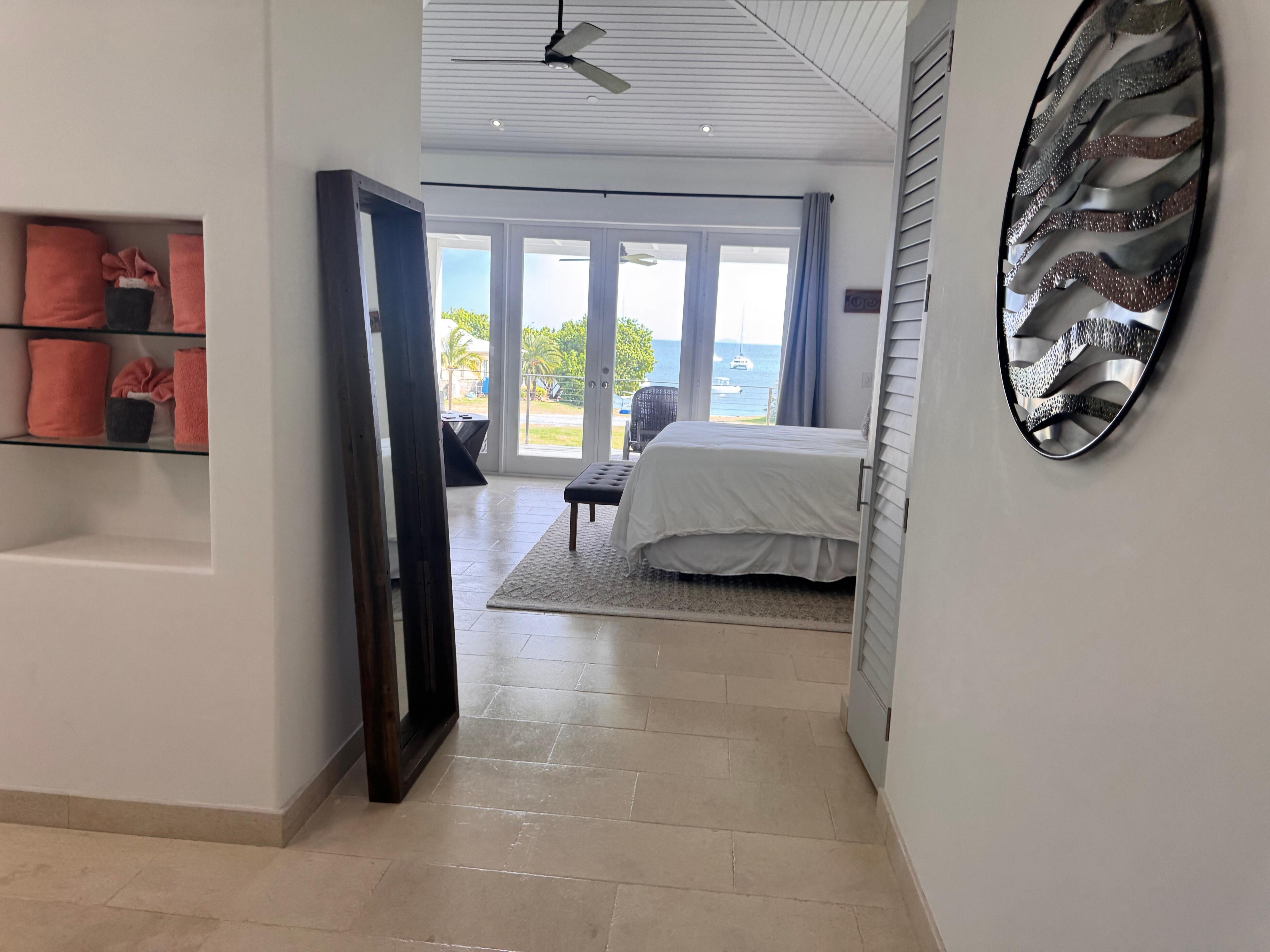 Primary bedroom overlooks the water