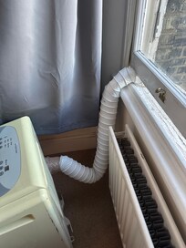 Air conditioner with duct tape on it