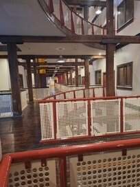 Noisy passing walkway interior and next to suites.