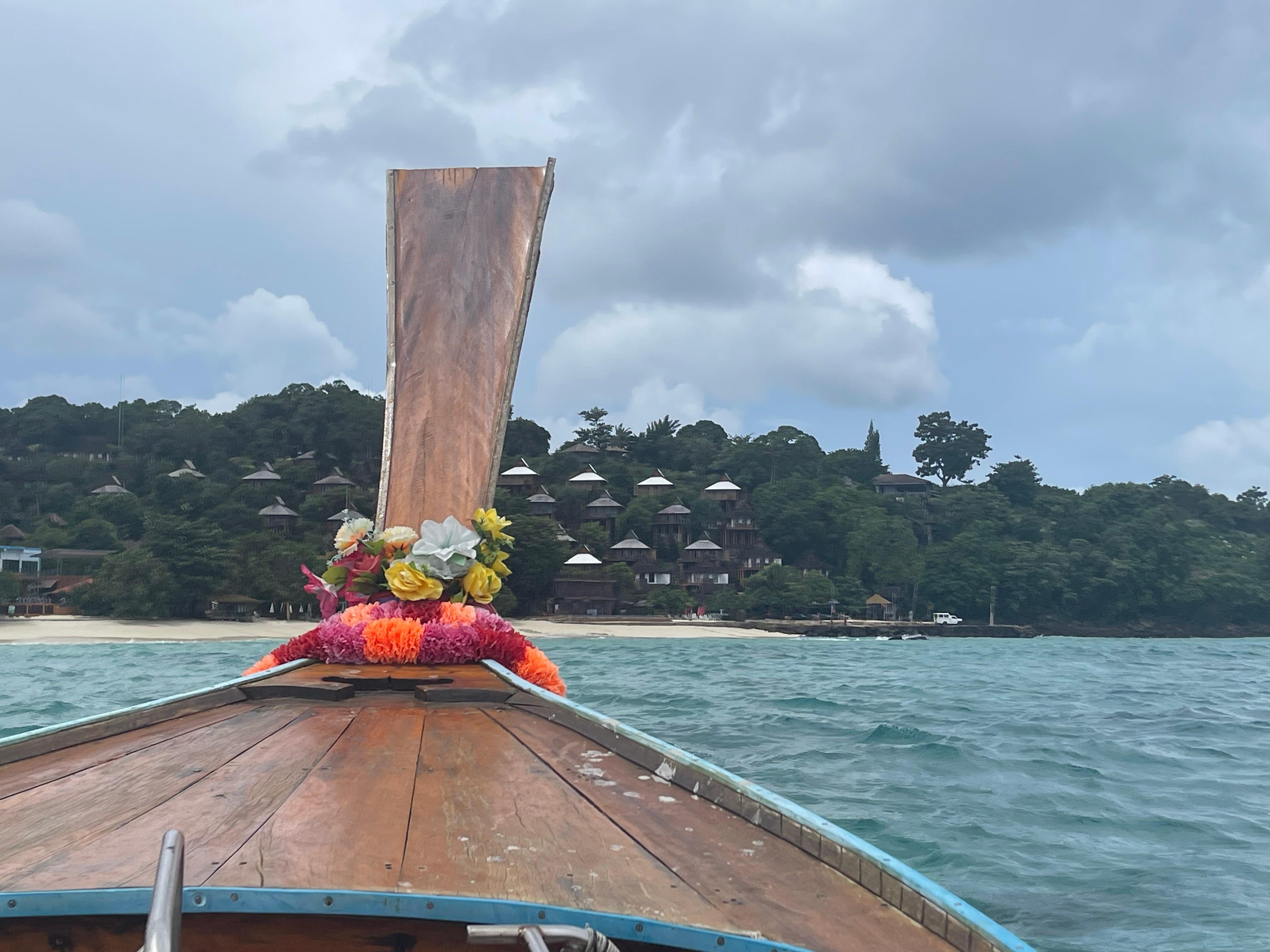 Longboat ride with rooms in the background. Maybe 15 min ride.