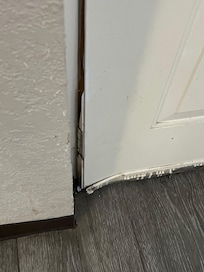 Door bent with no bottom hinge and does not seal