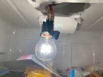 Broken hanging light inside refrigerator
