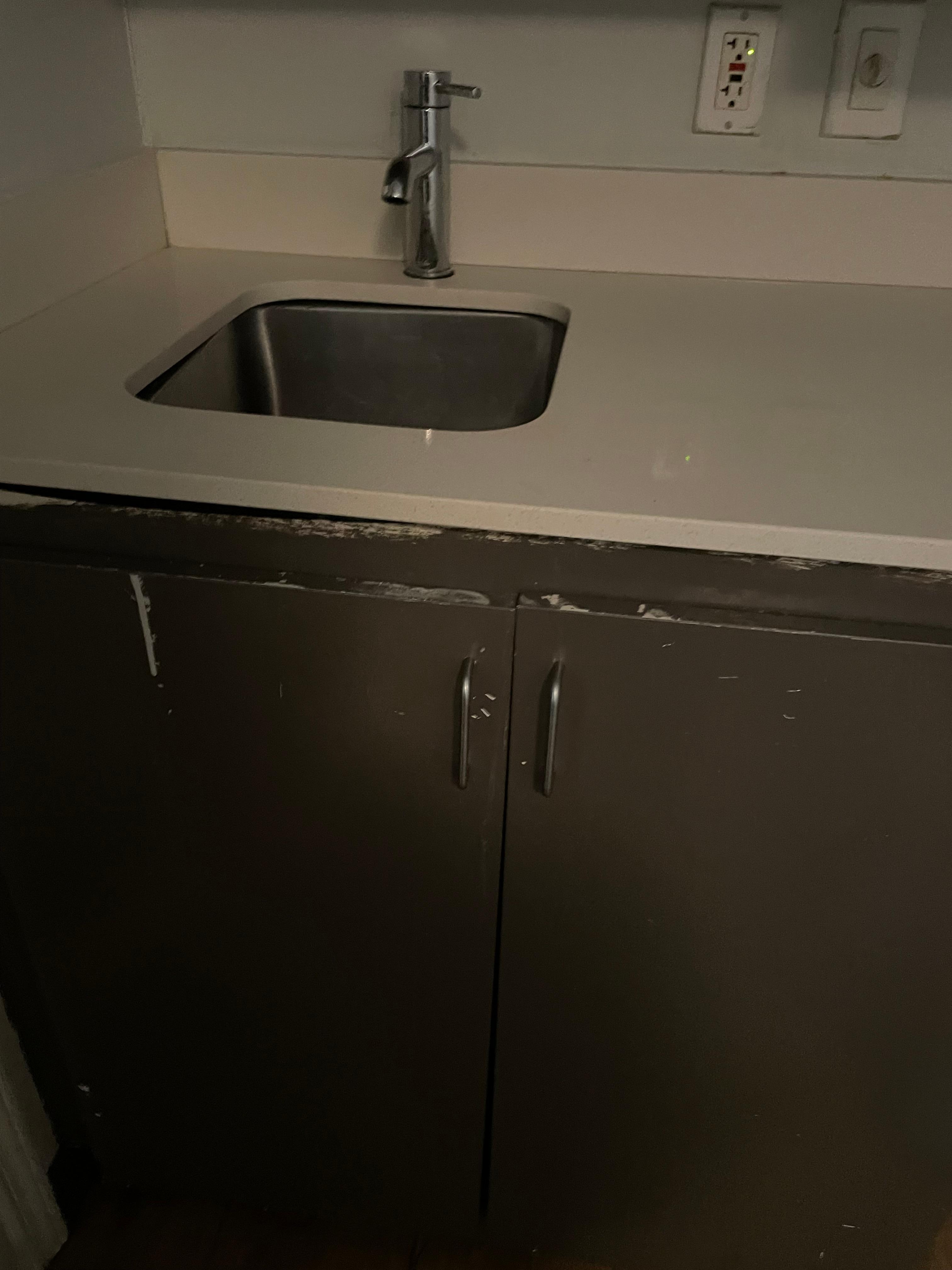 The cupboards are gross and the sink isn’t even fit right
