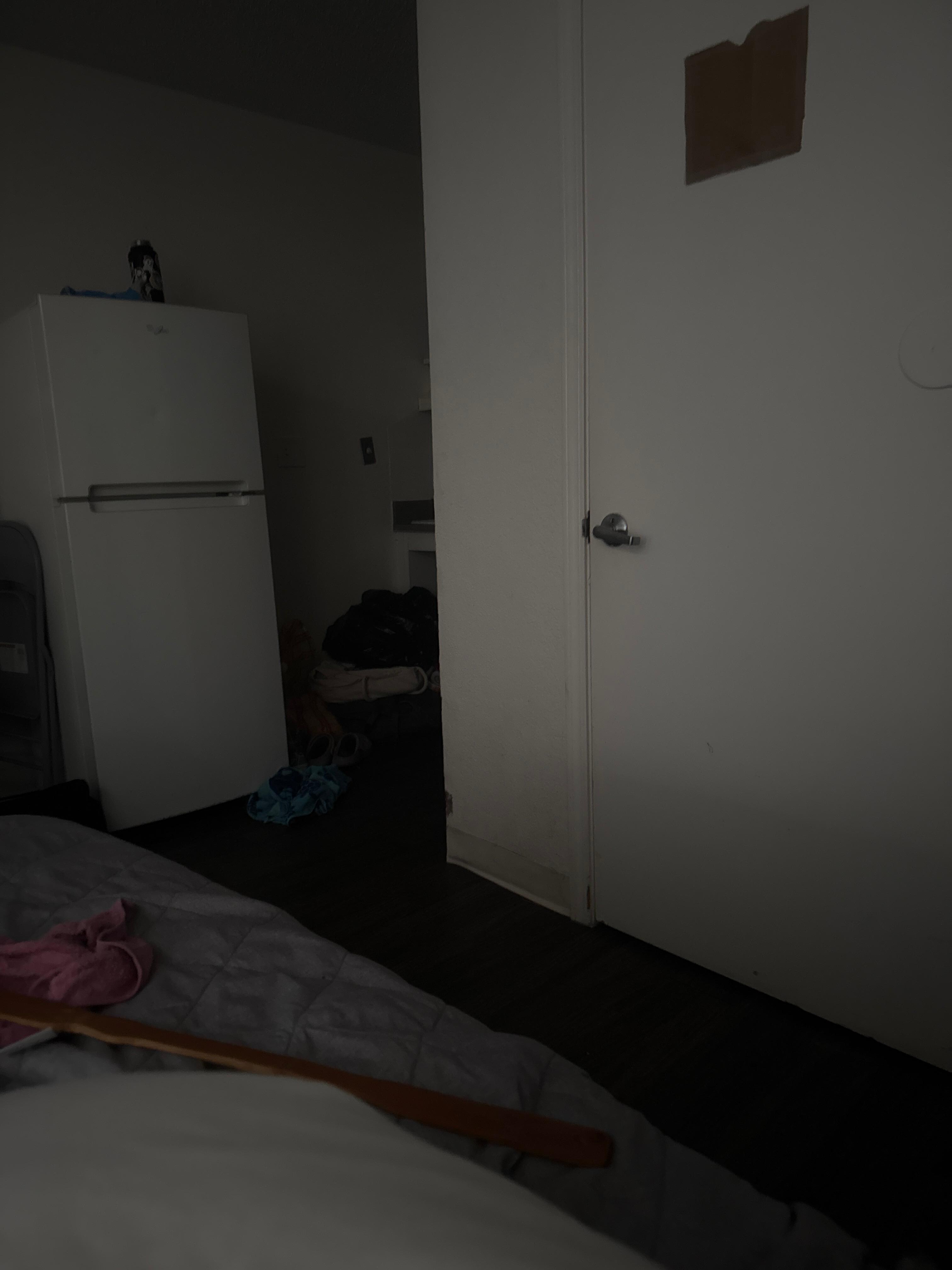 The kitchen area a little and bathroom door 