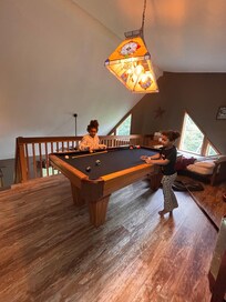 Pool table, toys & games to keep little ones busy.