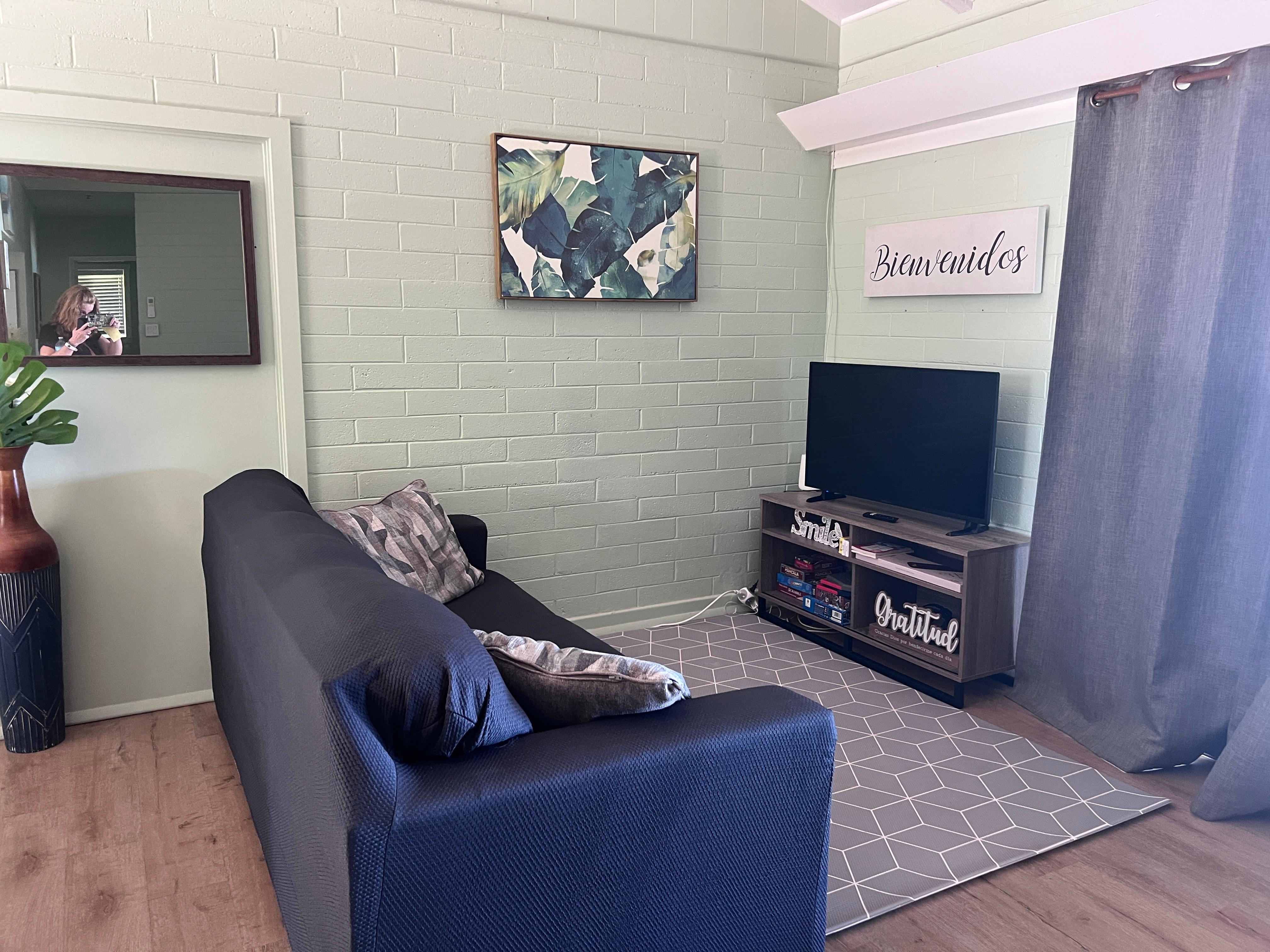 Living area next to dining area. Another sitting area to the right of the living area.