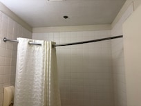 Bent shower curtain rod.