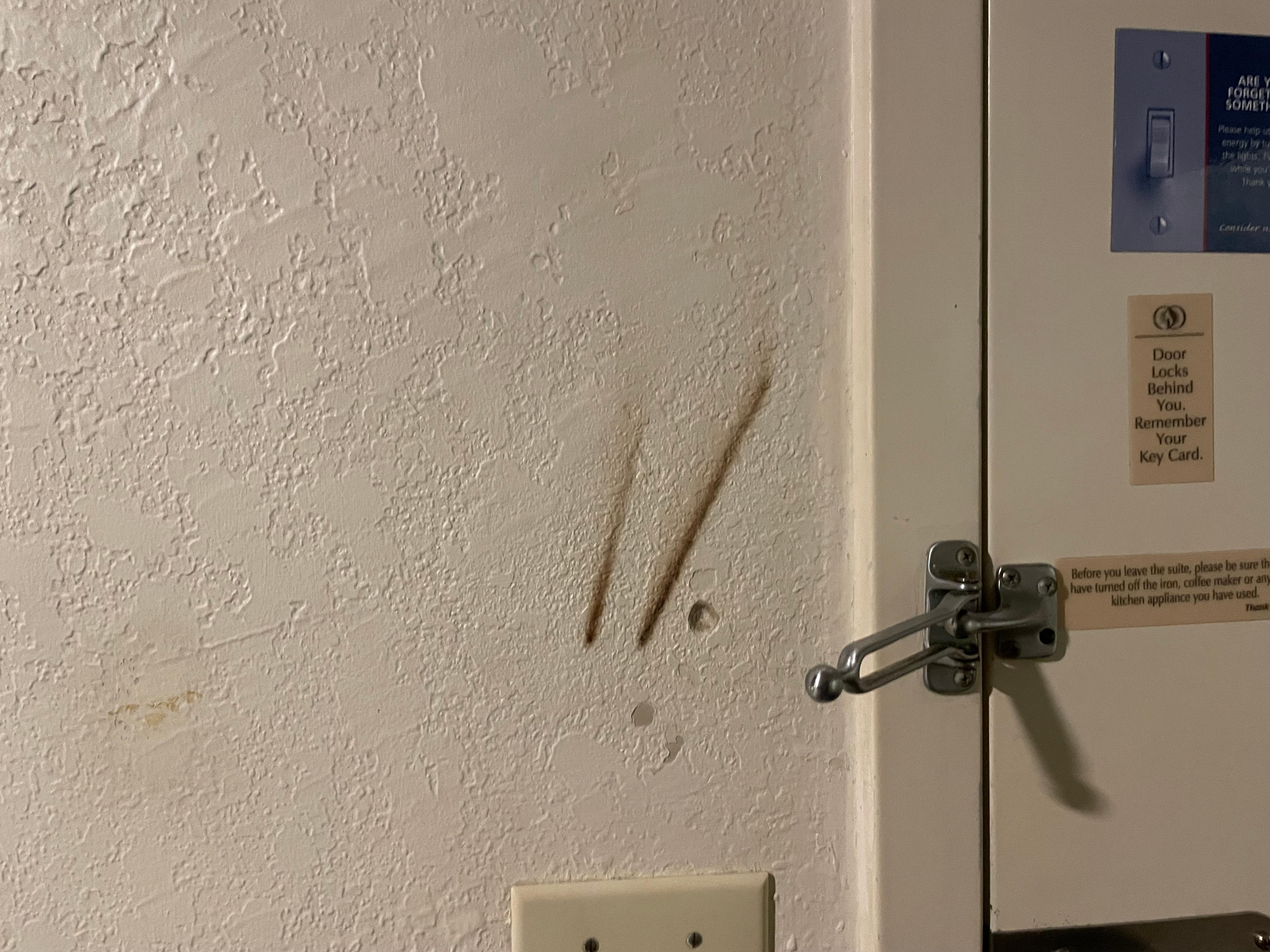 Stains on the wall by the door