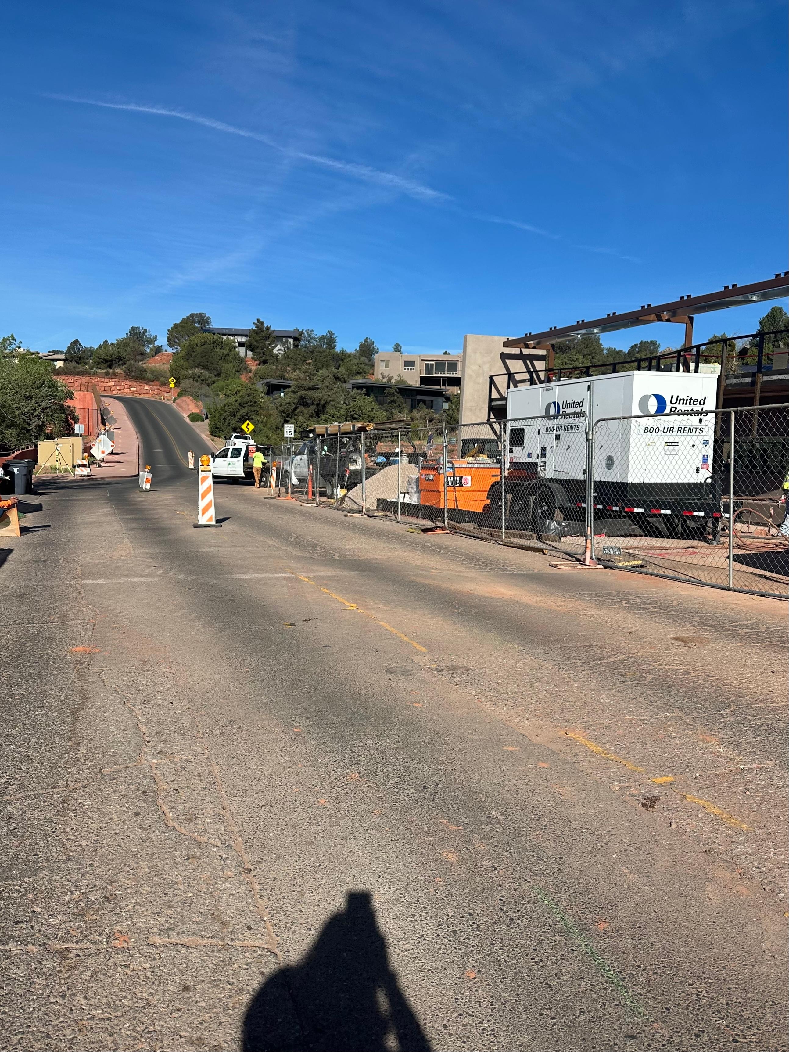 Entrance to home driveway, the construction project is a huge parking structure right in front of house