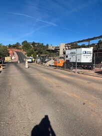 Entrance to home driveway, the construction project is a huge parking structure right in front of house