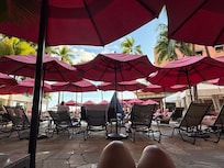 Pool area, not much breeze, damaged chairs