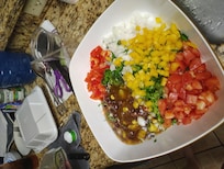 Making cowboy caviar in the kitchen.